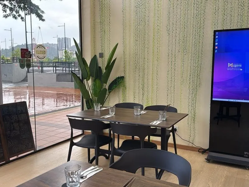 Temu Vegan Restaurant dining area digital standee Penang